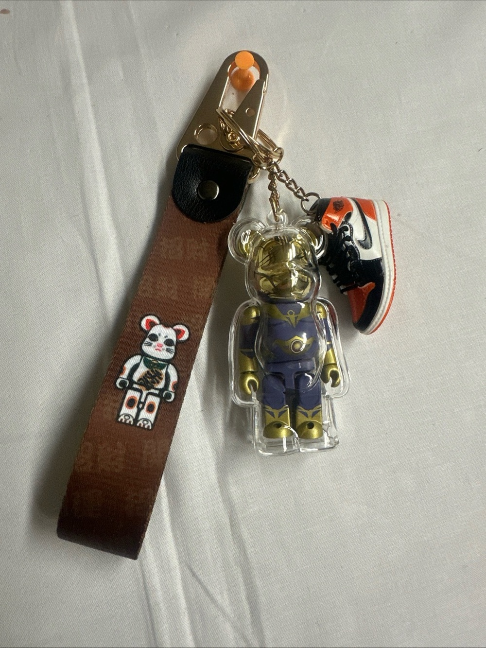 Gold & Purple Bear Keychain with Orange-Black Sneaker Charm